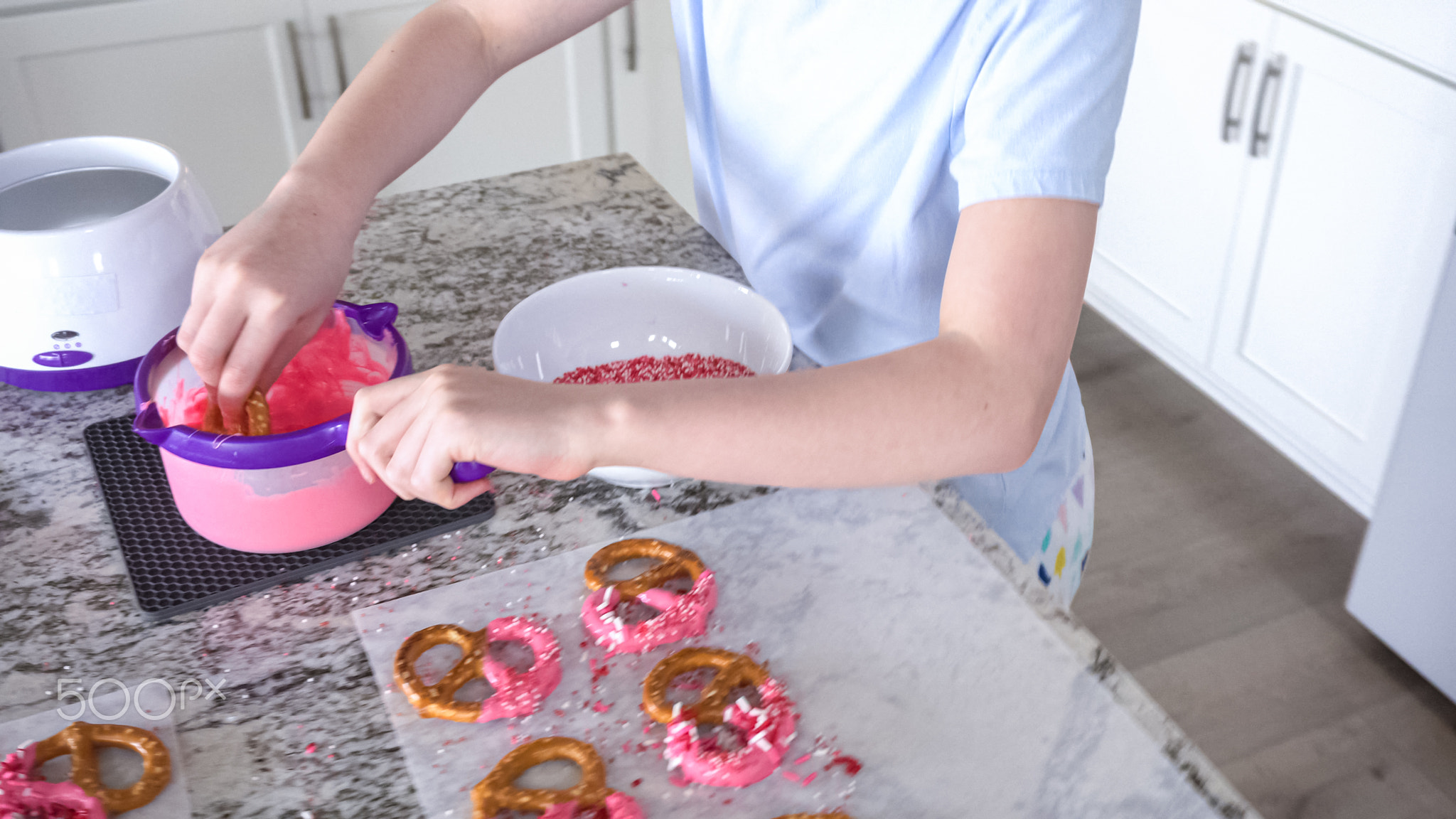 Young Chef Prepares Chocolate-Covered Treats in Sunny Kitchen