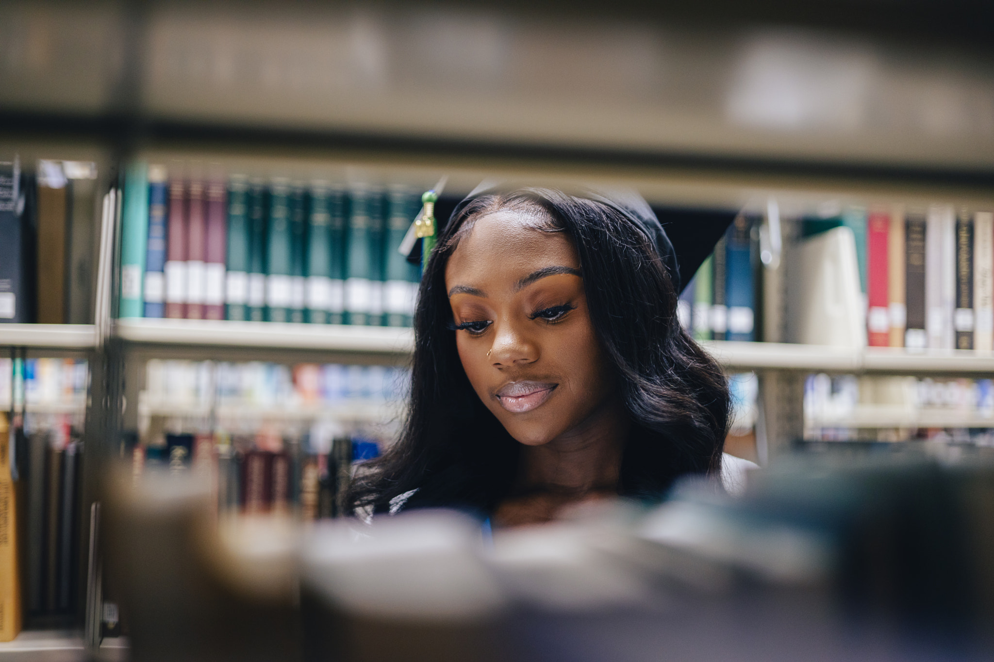 Young woman librarian cataloguing books