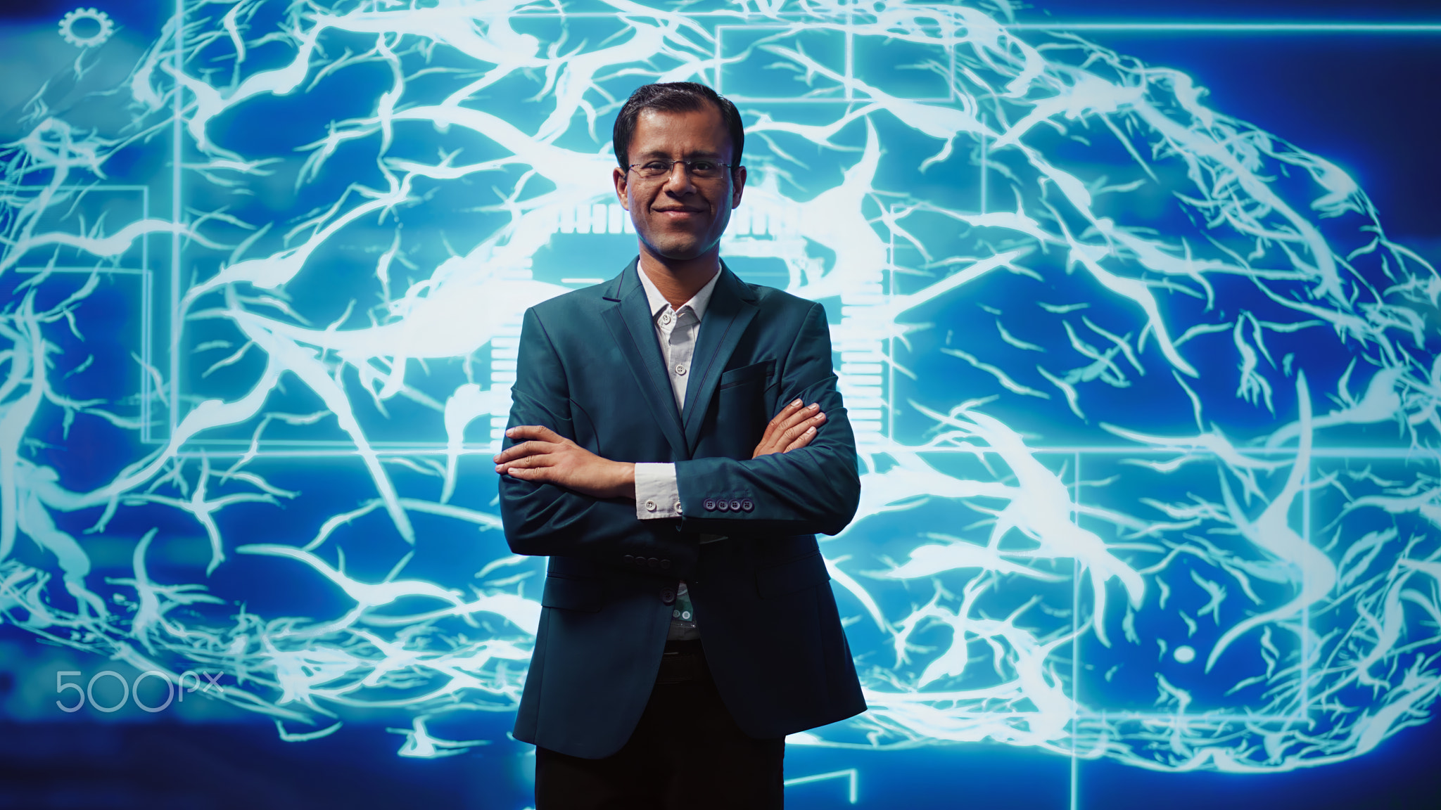 Portrait of happy man standing with arms crossed in front of AI brain