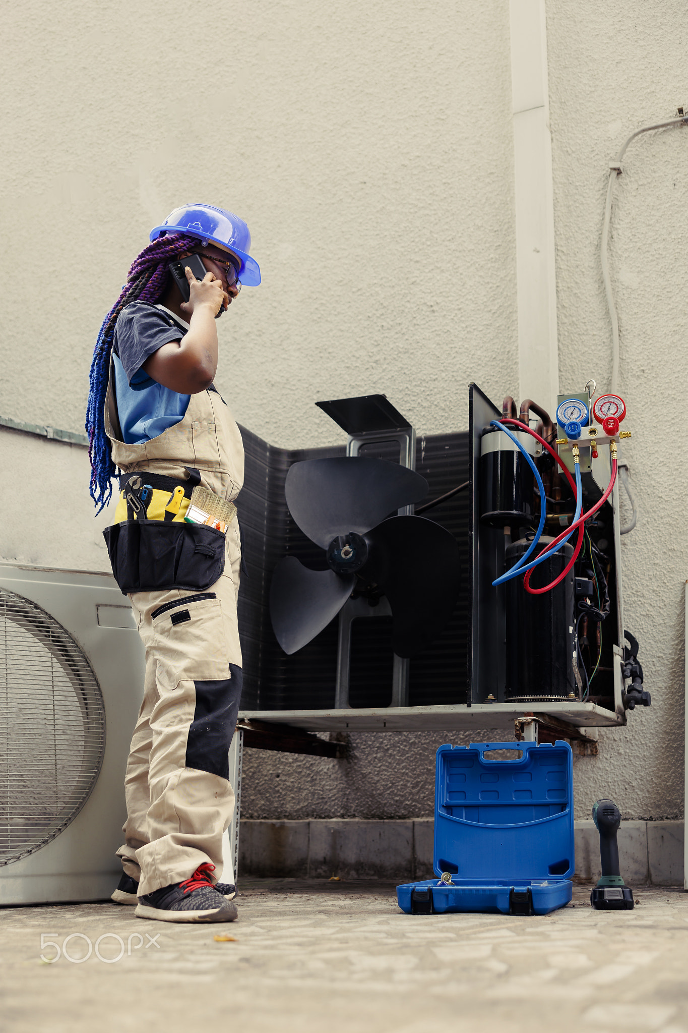 Engineer on the phone with home owner