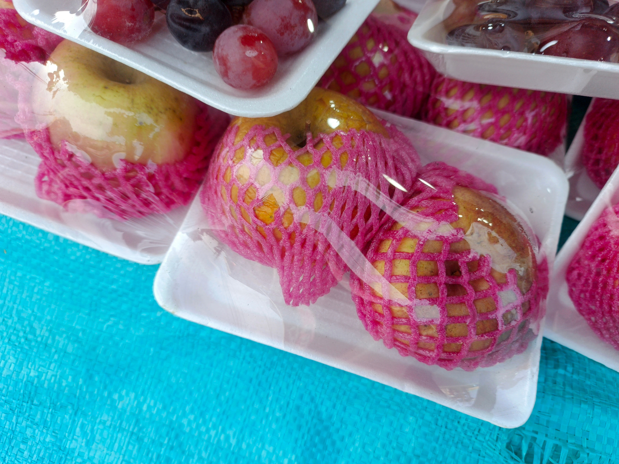 High angle view of colorful candies in plastic bag on table