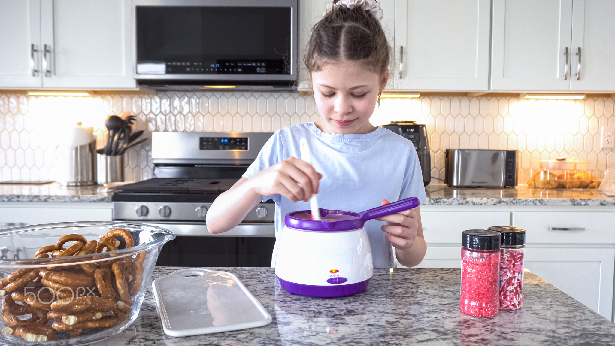 Young Chef Prepares Chocolate-Covered Treats in Sunny Kitchen