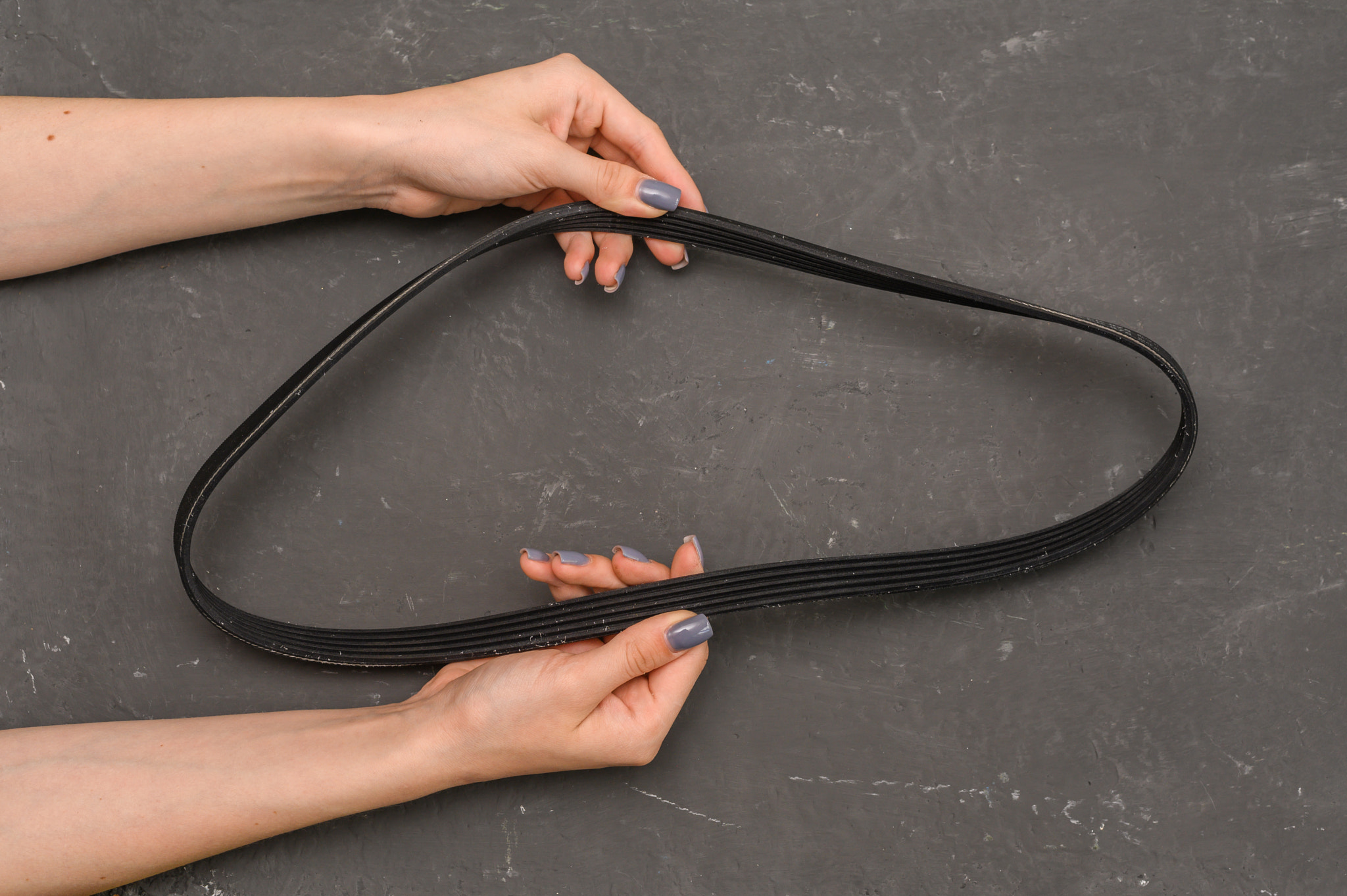 car generator belt in hand