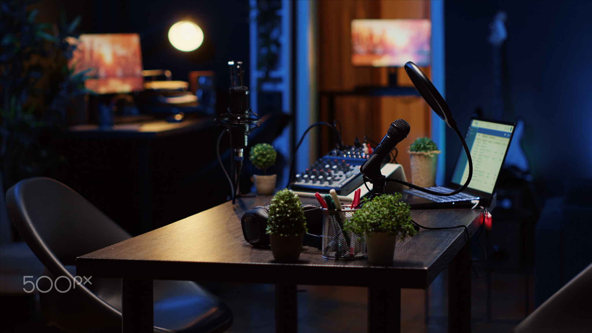 Empty desk in home production studio with podcast equipment technology