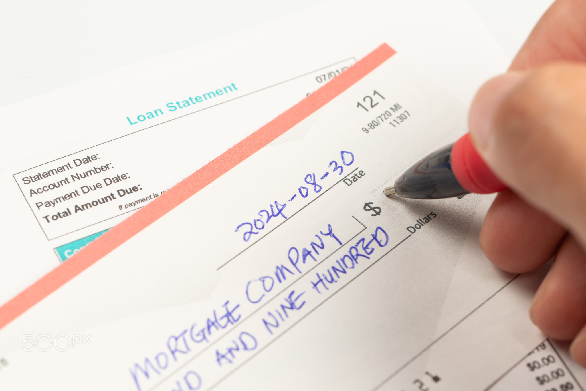 Writing a check for the mortgage payment