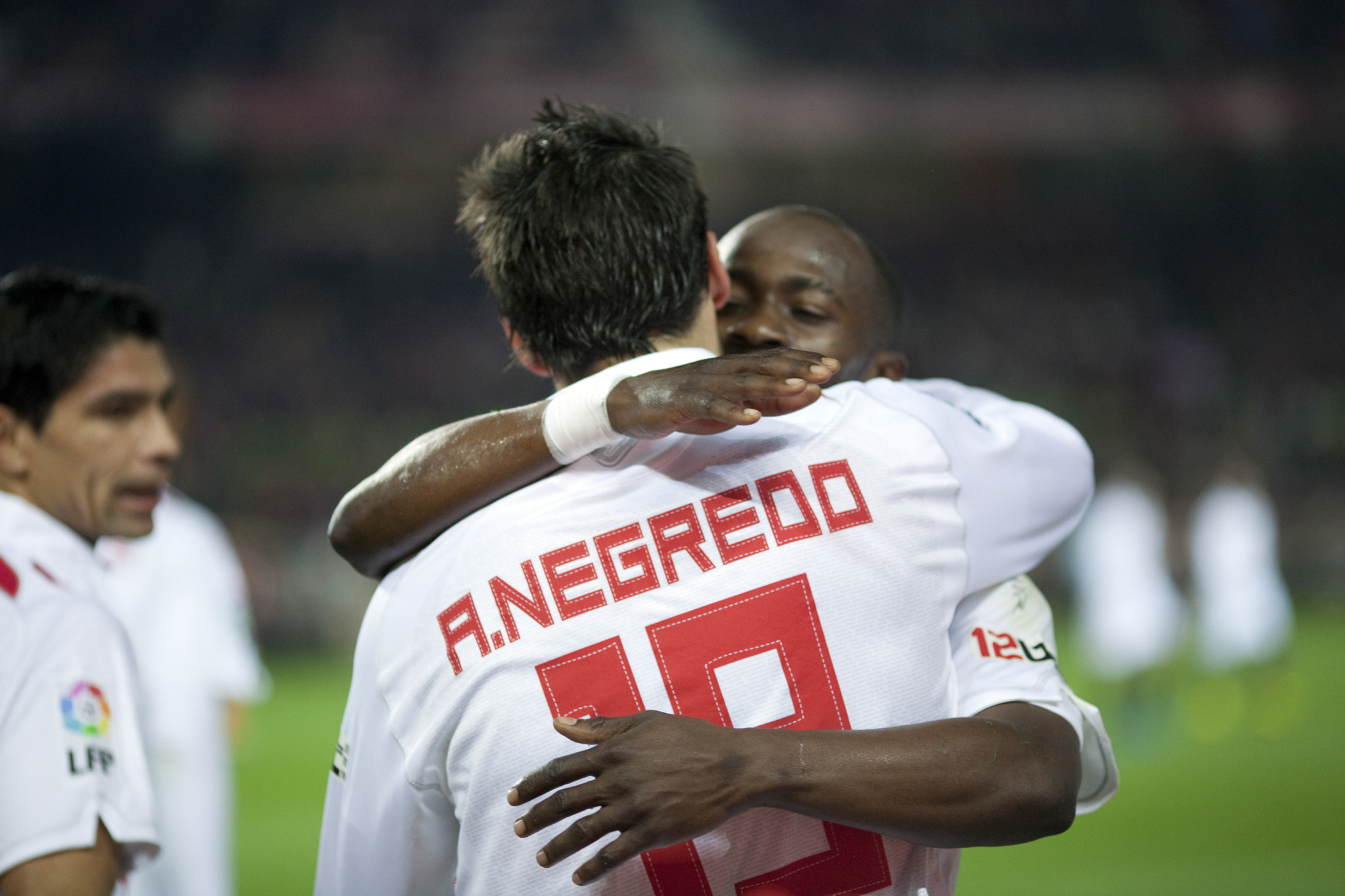 Zokora and Negredo hugging after a goal scoring. Spanish Liga game between Sevilla FC and Valencia C