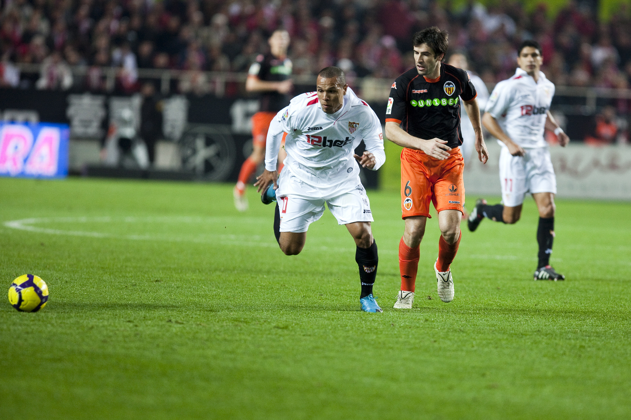 Luis Fabiano trying to reach the ball. Spanish Liga game between Sevilla FC and Valencia CF. Sanchez