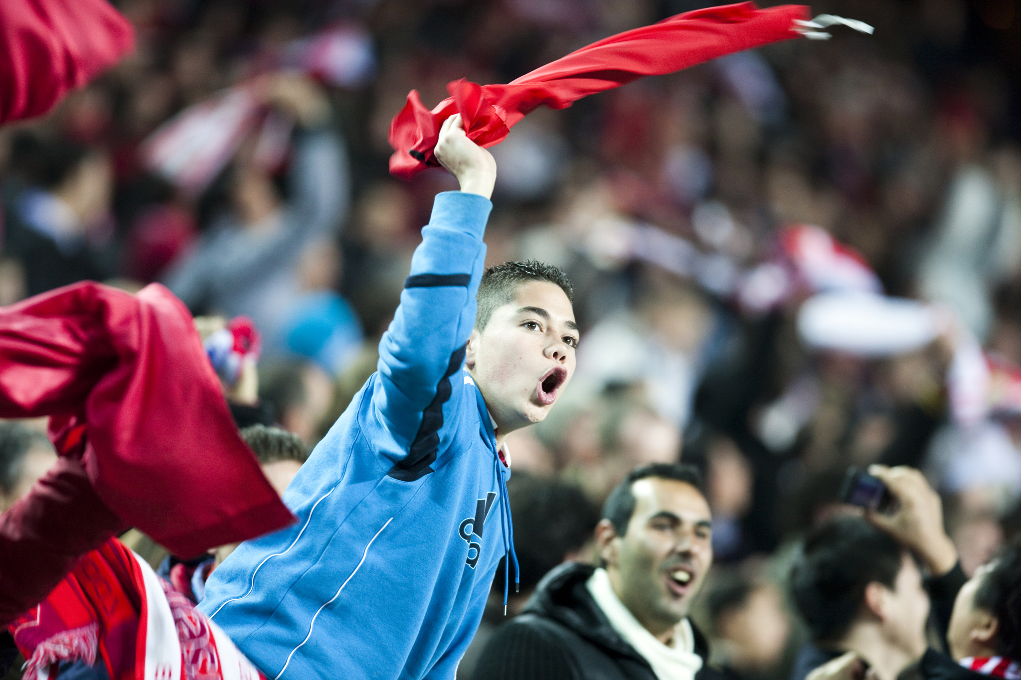 Young Sevilla FC fan celebrates a goal. Spanish Liga game between Sevilla FC and Valencia CF. Sanche