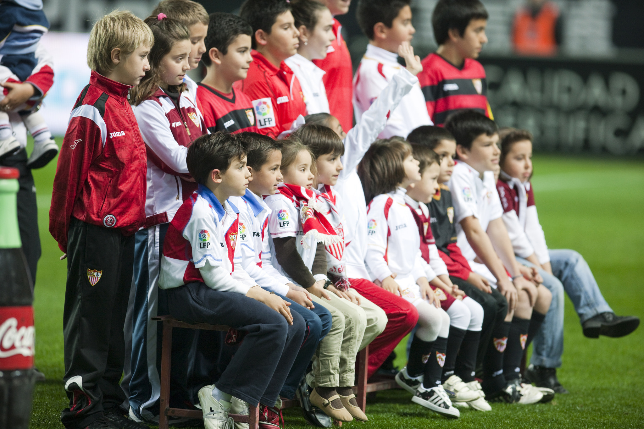 Young Sevilla FC fans ready to pose with the squad. Spanish Liga game between Sevilla FC and Valenci