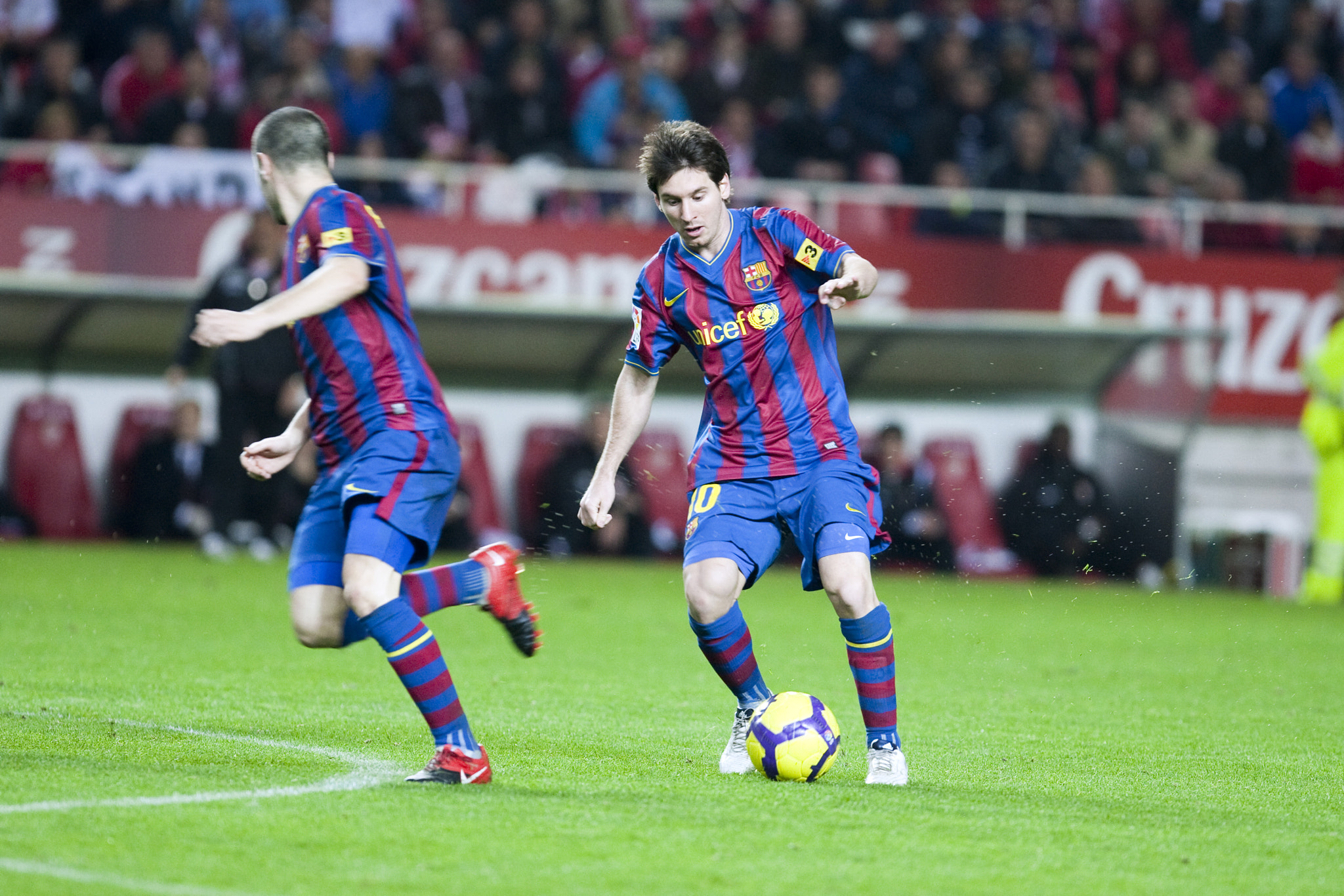 Messi with the ball before Iniesta. Spanish Cup game between Sevilla FC and FC Barcelona, Ramon Sanc