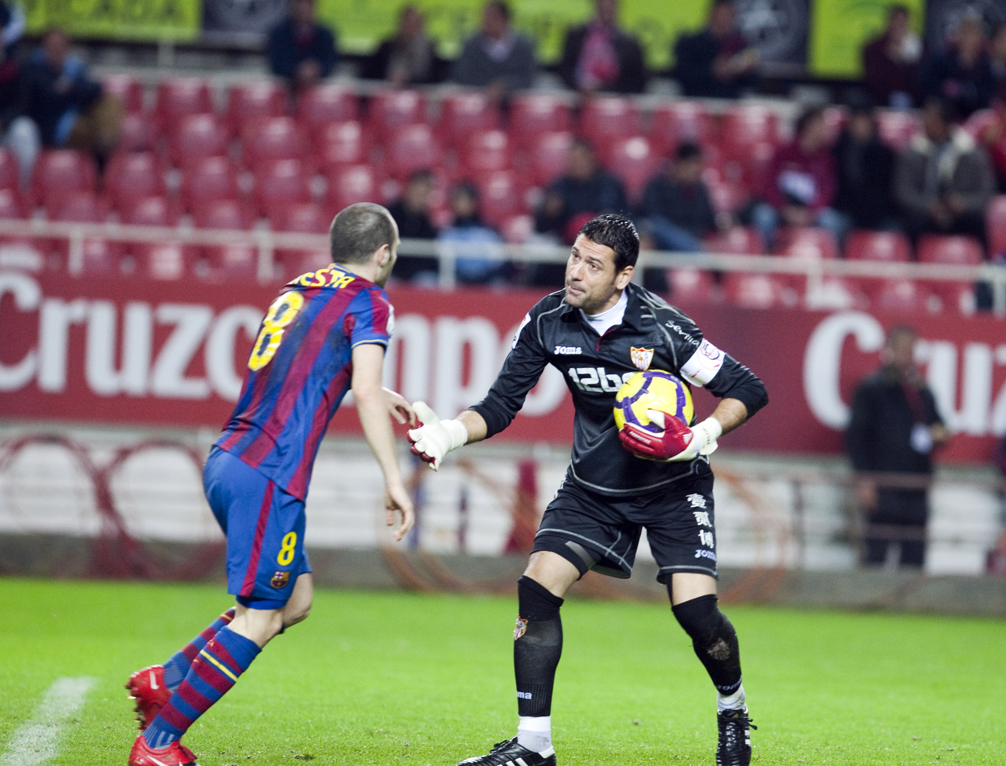 Palop and Iniesta. Spanish Cup game between Sevilla FC and FC Barcelona, Ramon Sanchez Pizjuan stadi