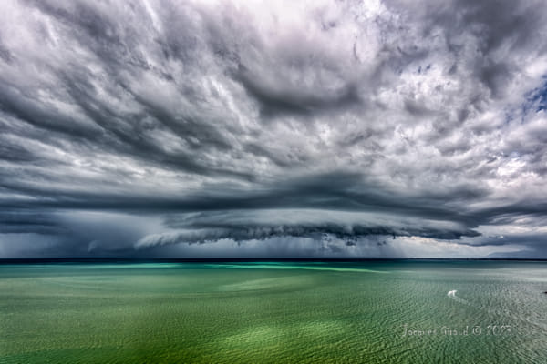Storm Clouds Gather Over Water Portraying Imminent Change | nature