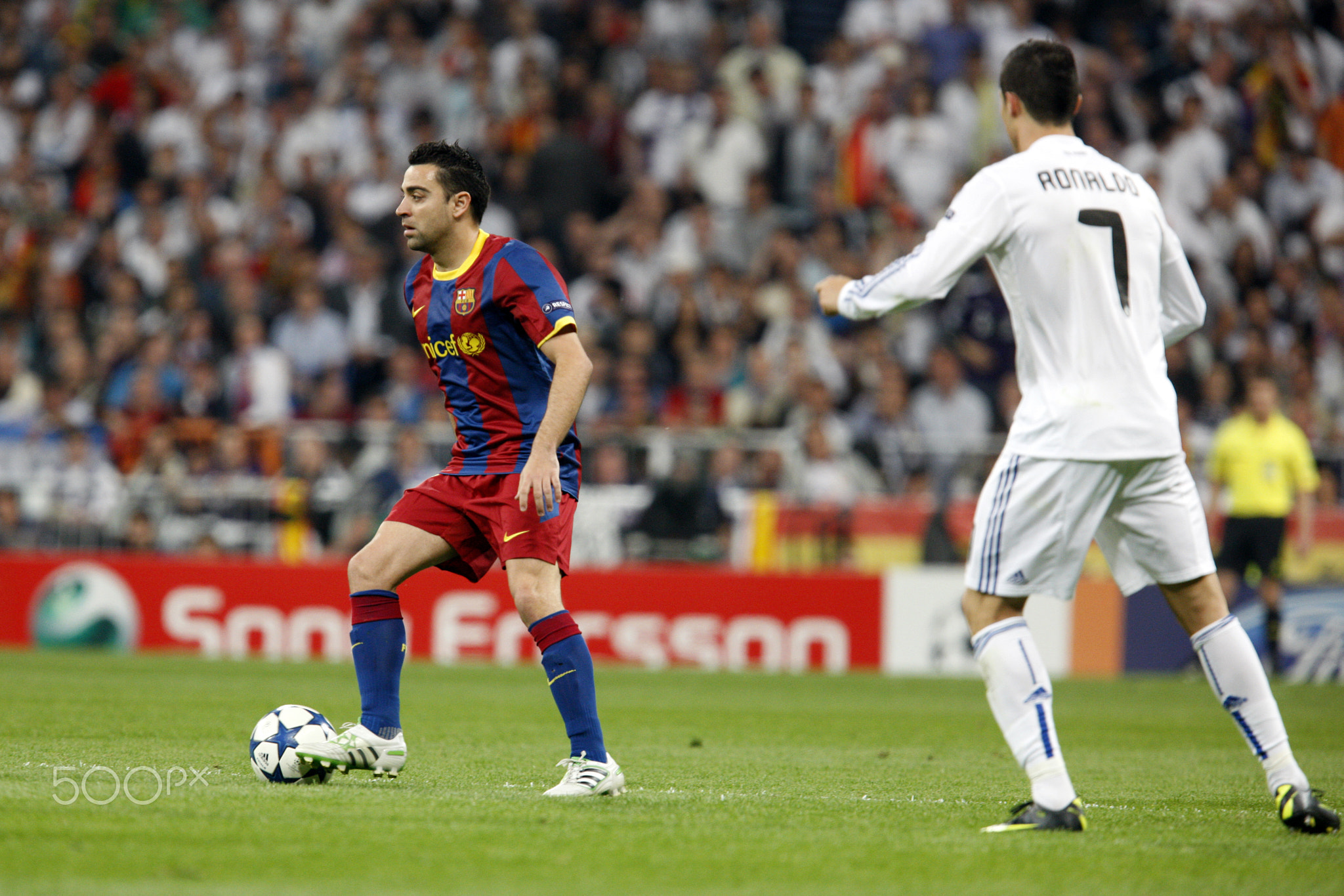 Xavi watched by Cristiano Ronaldo, UEFA Champions League Semifinals game between Real Madrid and FC