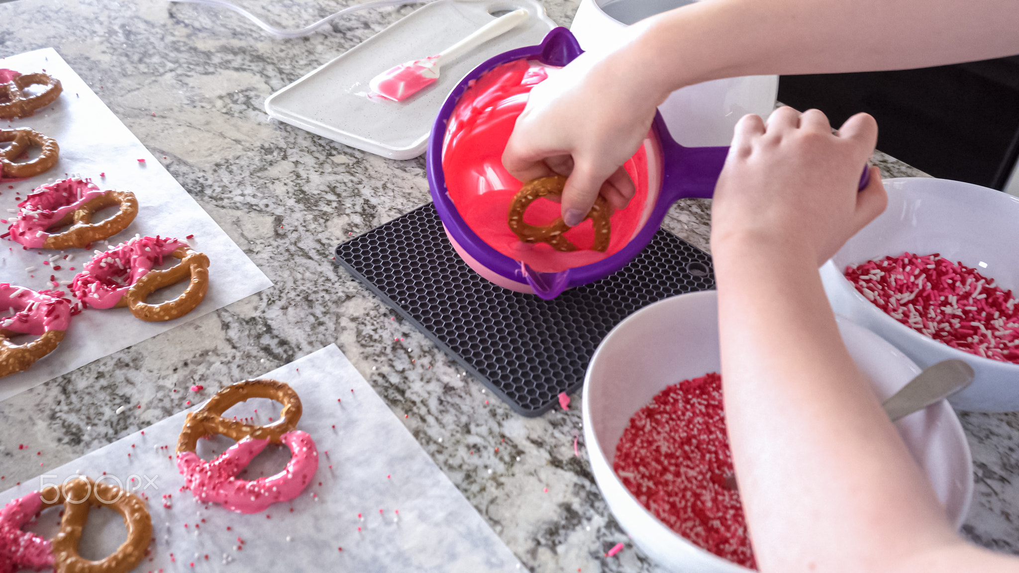 Young Chef Prepares Chocolate-Covered Treats in Sunny Kitchen