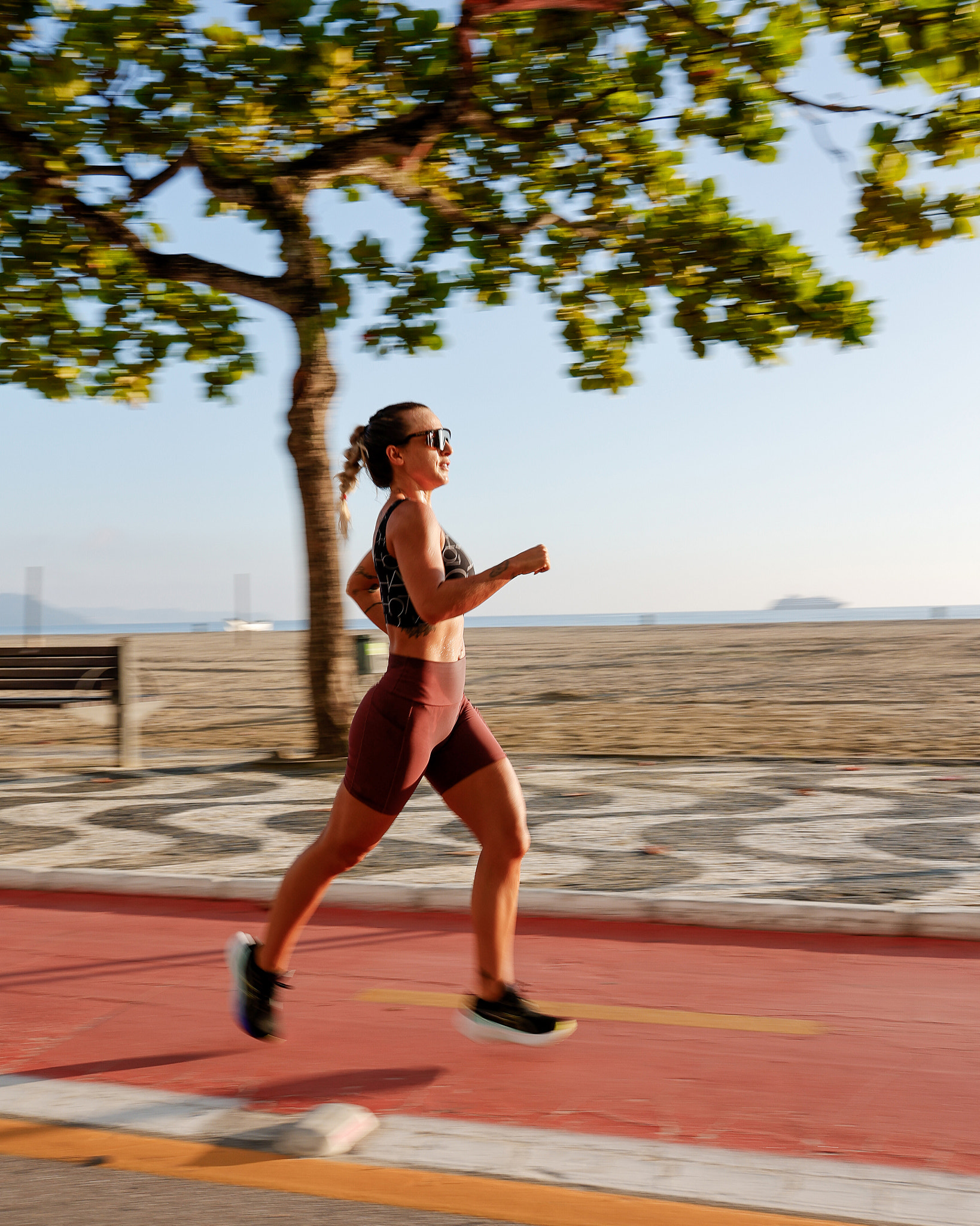 Young woman running on the beach