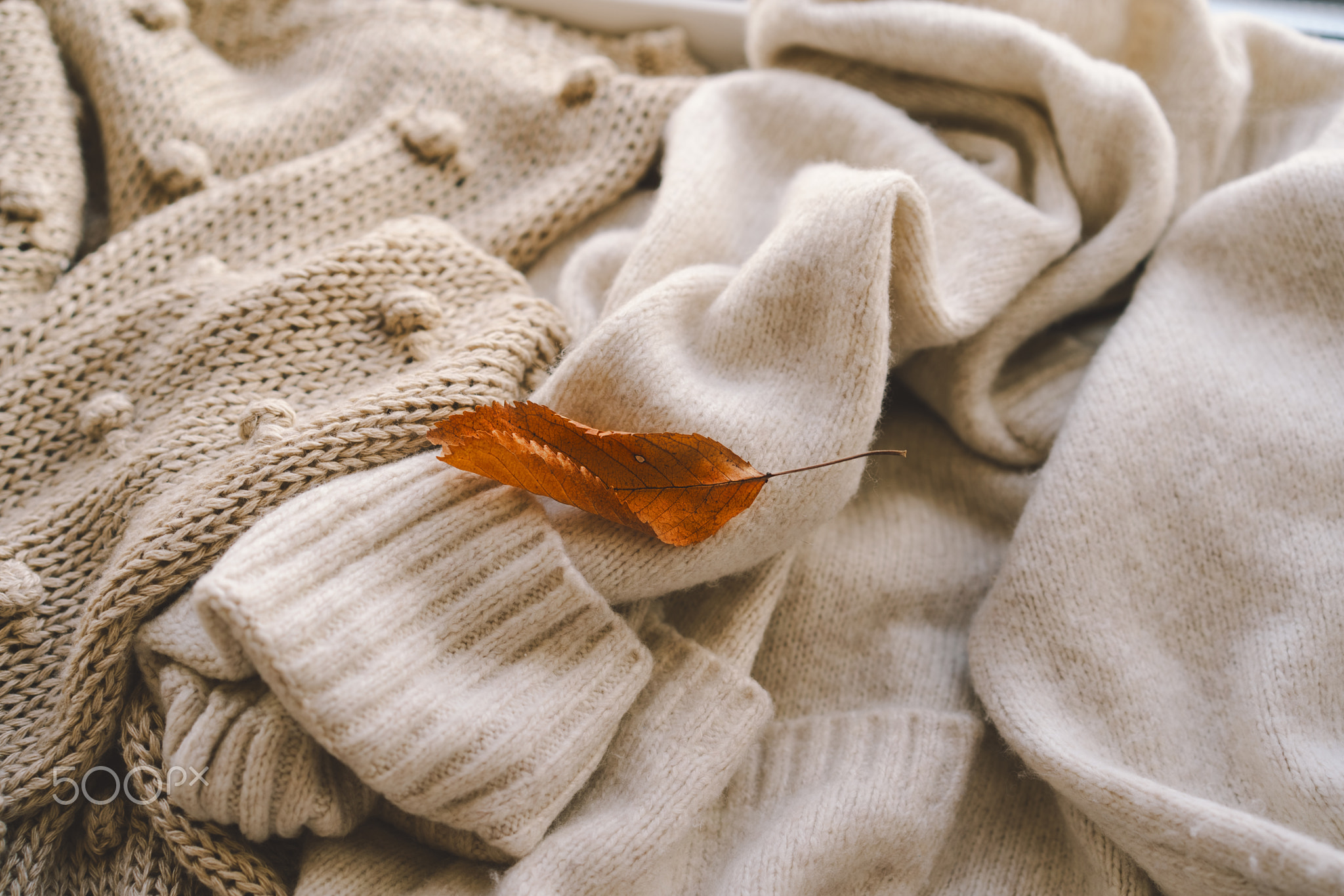 The texture of cozy beige knitwear