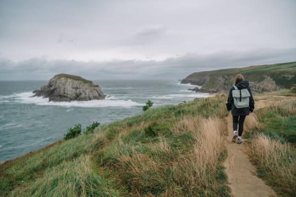 Woman explores coastal path by Olha Dobosh on 500px.com