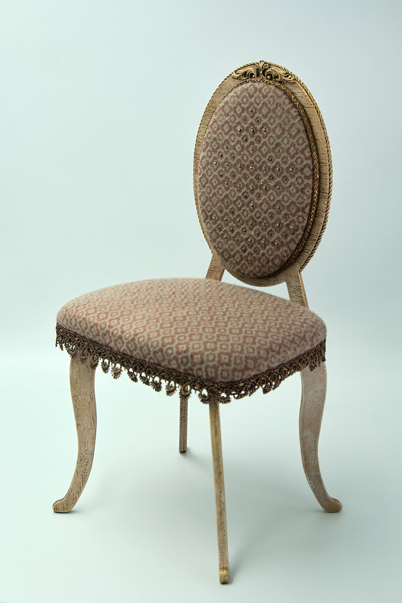 Close-up of miniature chair against white background