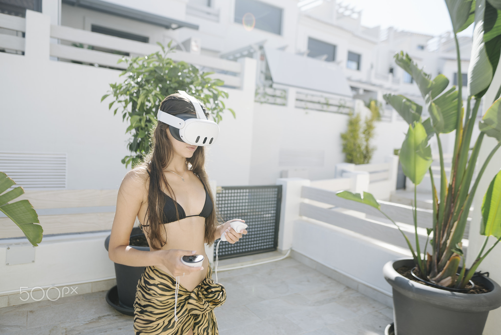A Young Woman is Joyfully Enjoying Her Virtual Reality Experience in the Great Outdoors