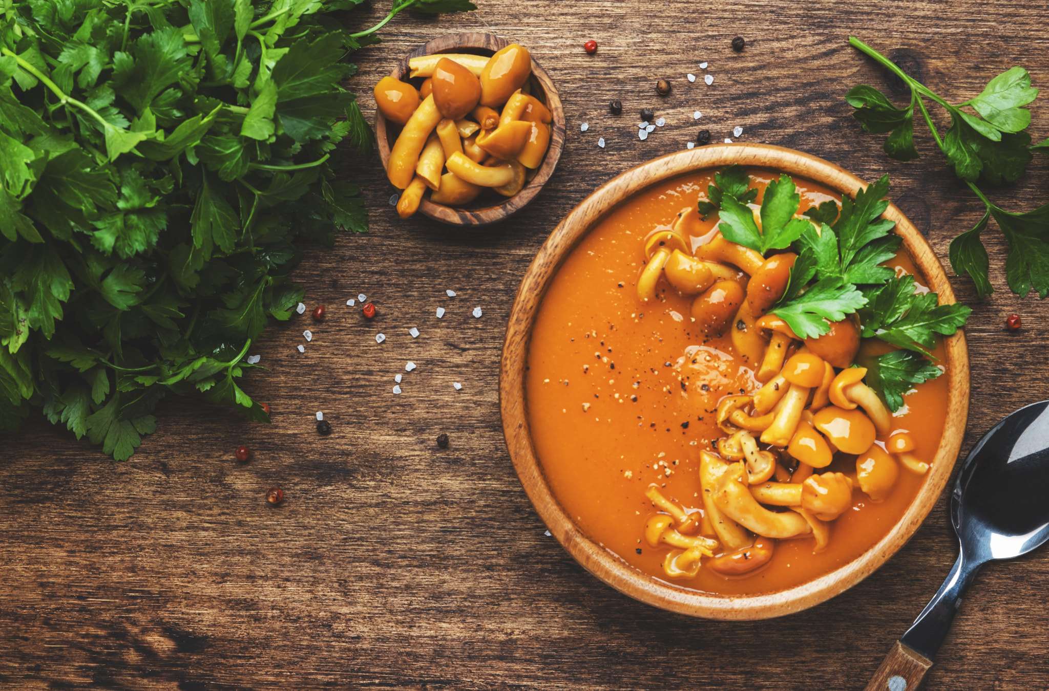 Spicy pumpkin sreamy soup with mushrooms, pepper and parsley. Winter or autumn healthy vegan vegetar