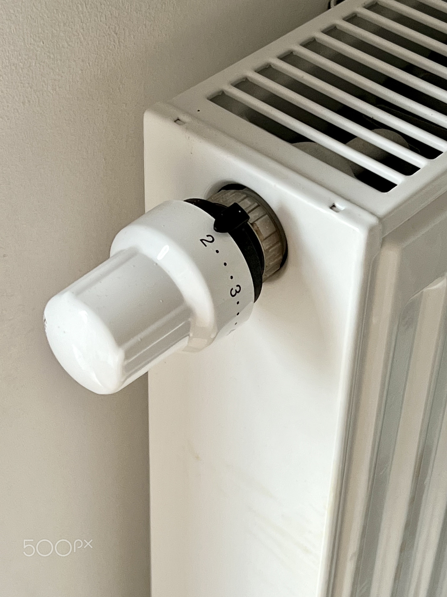 A close-up of the radiator and the radiator temperature control