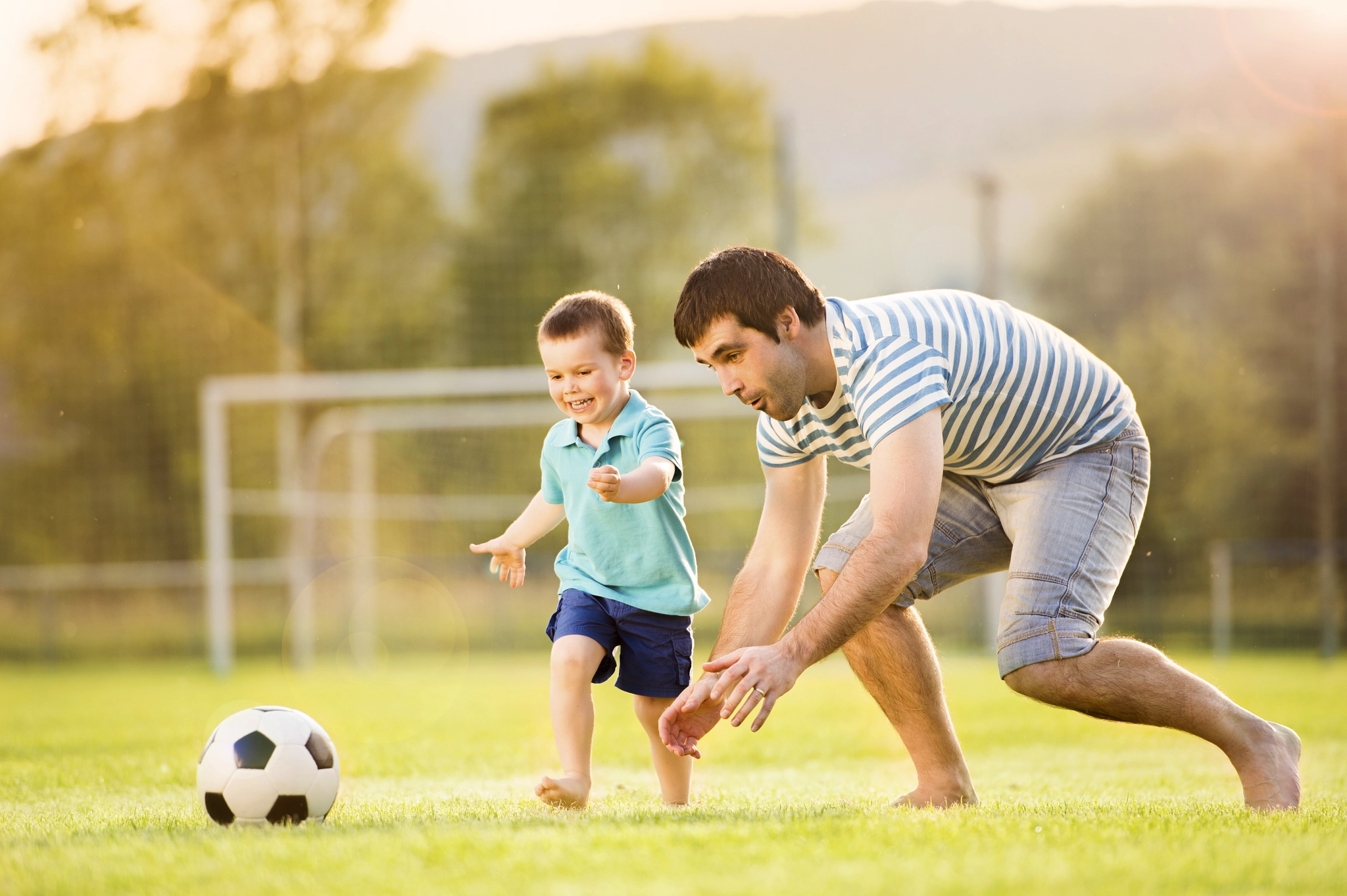 father-and-son-playing-football-by-jozef-polc-photo-110279283-500px