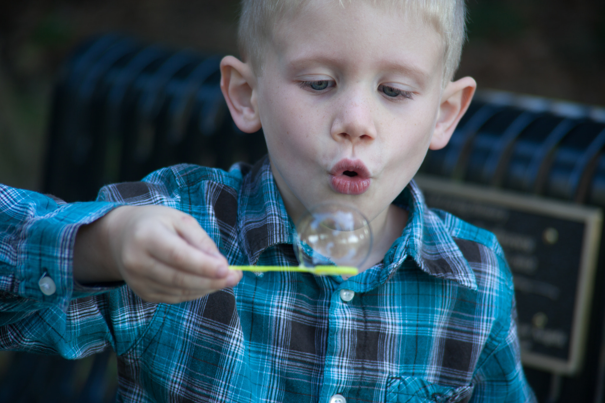 Canon EF 28-200mm F3.5-5.6 USM sample photo. Boy blowing bubbles photography