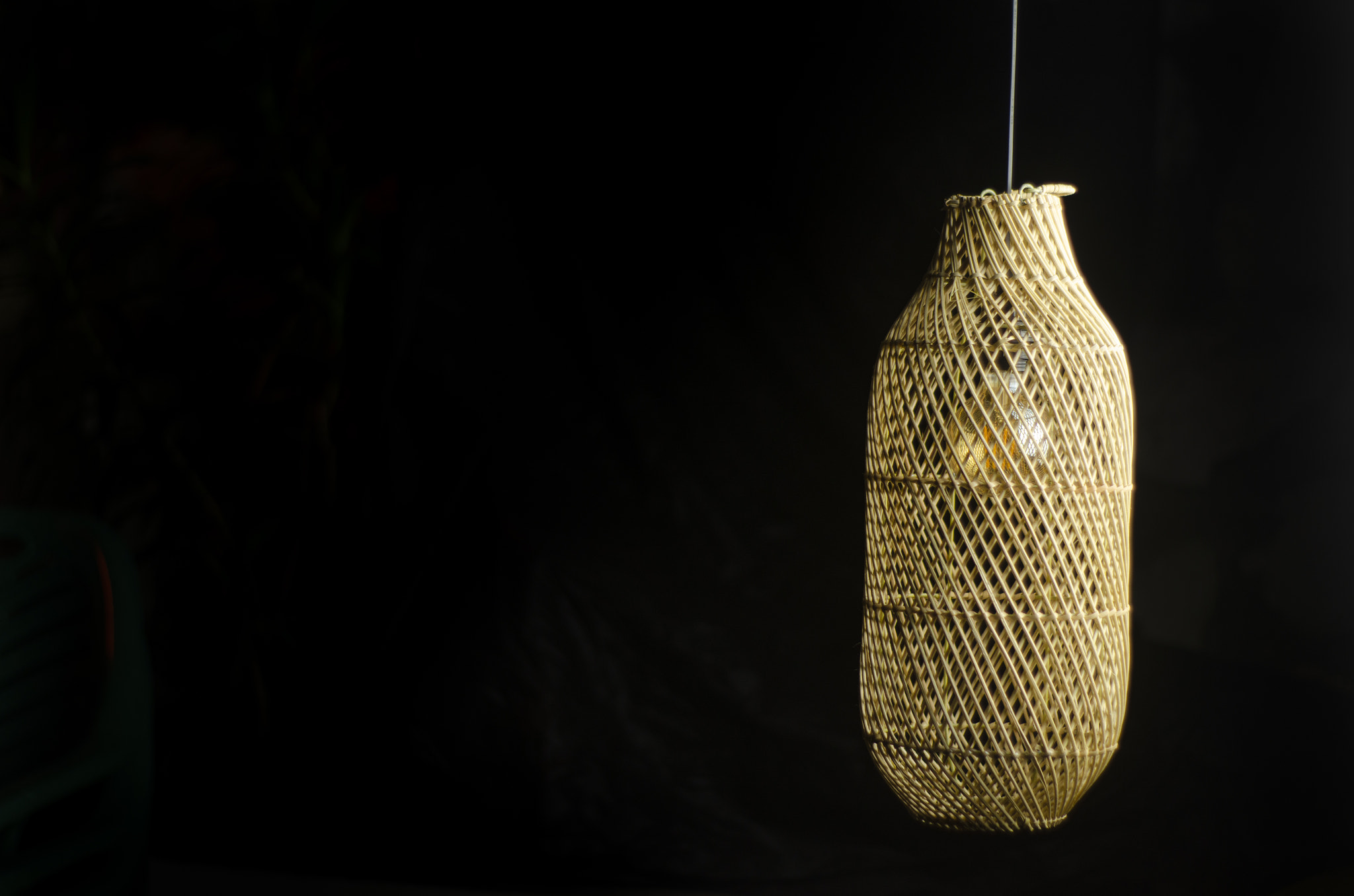 Close-up of illuminated string light against black background
