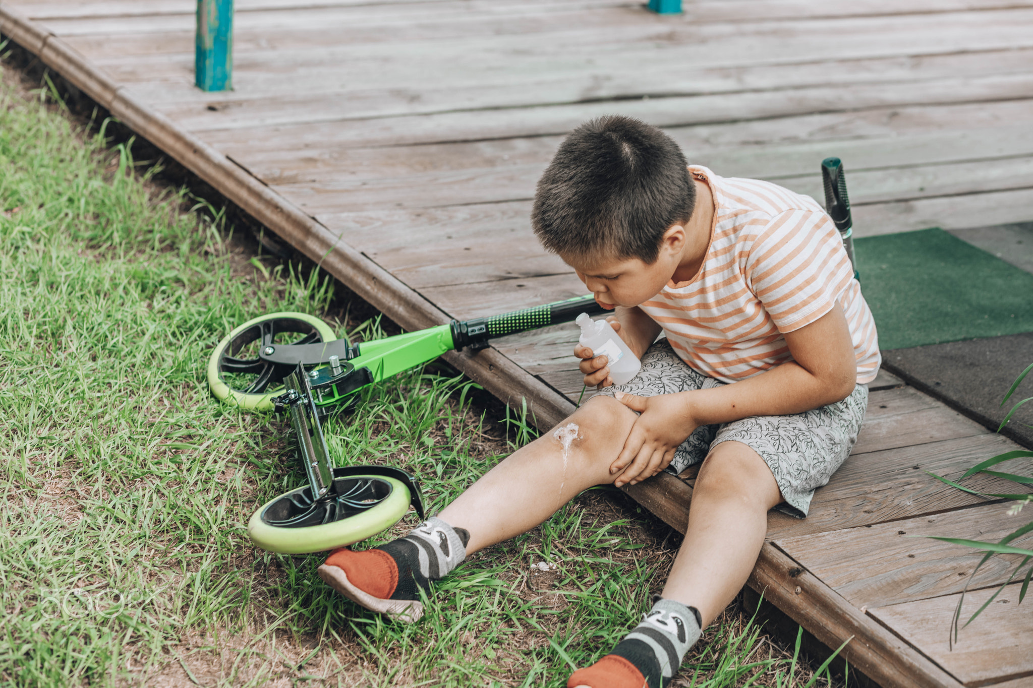 The First Bandage: A child's initiation into the world of first-aid, showing determination and care
