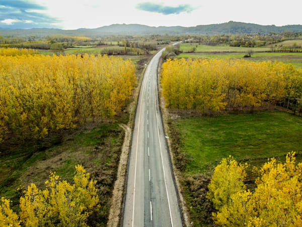 Aerial view of road amidst field against sky by NECMETT?N SOBUTAY on 500px.com