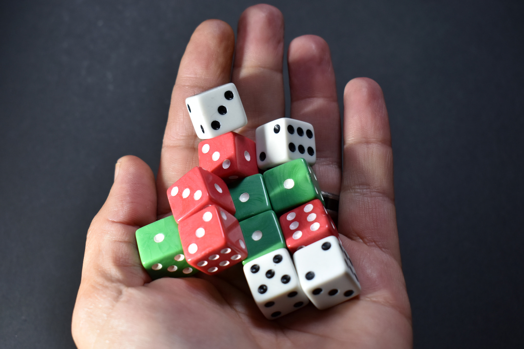 Cropped hand holding dice