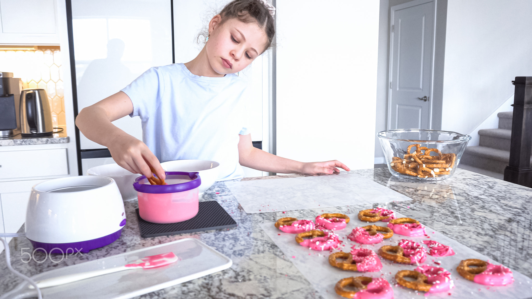 Young Chef Prepares Chocolate-Covered Treats in Sunny Kitchen