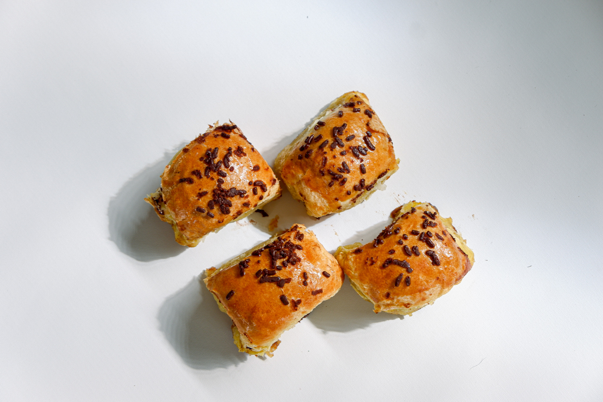 Close photo of brown banana bread on white background