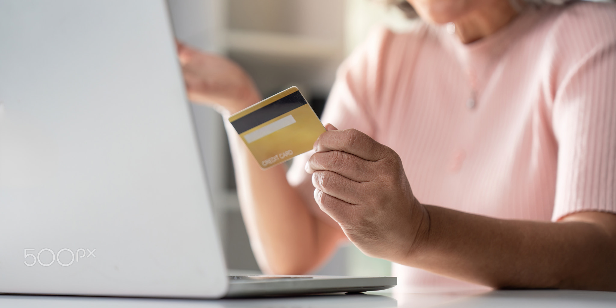 Elderly online shopping experience with credit card home environment