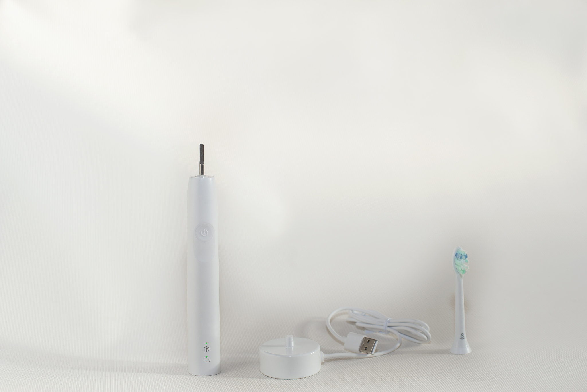 Electric sonic toothbrush isolated on white background
