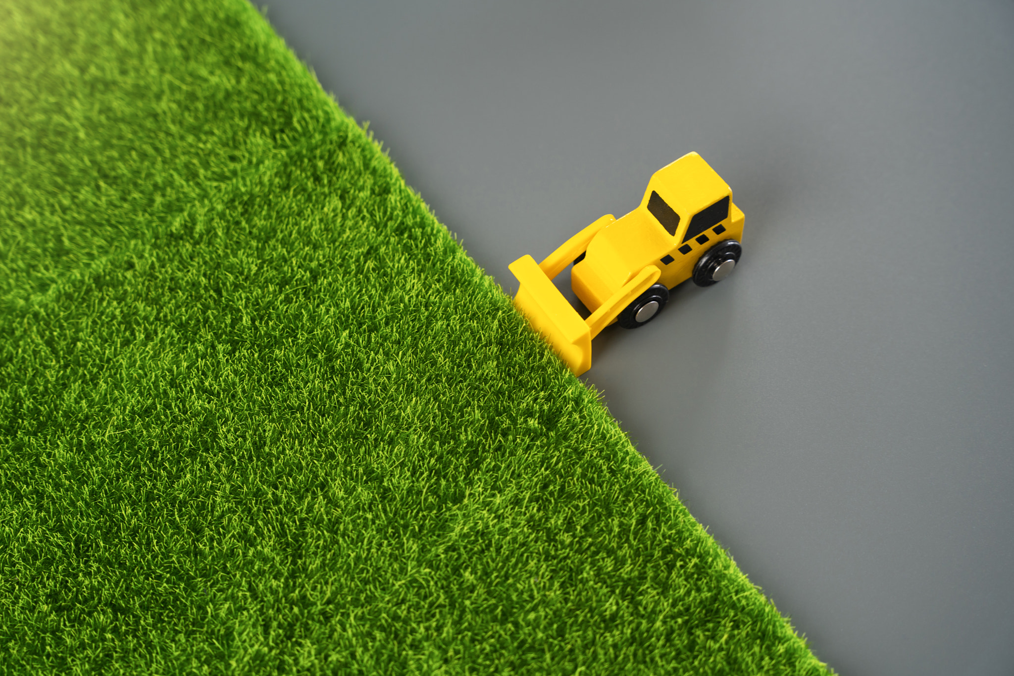 A bulldozer levels the area for construction, concept. Nature destruction of for technogenic develop