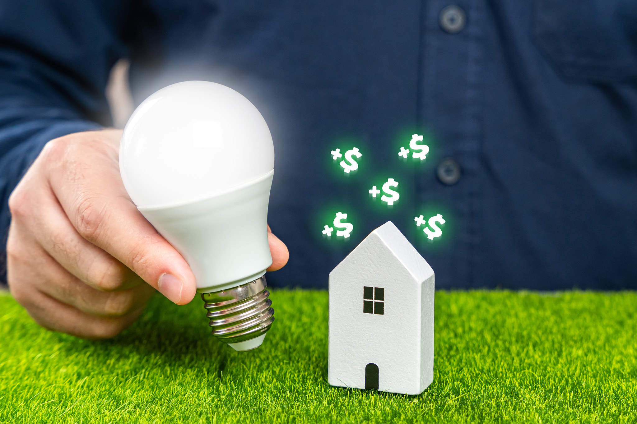 Save electricity at home and gain money. Utilities services. Save on bills. A man holds a glowing li