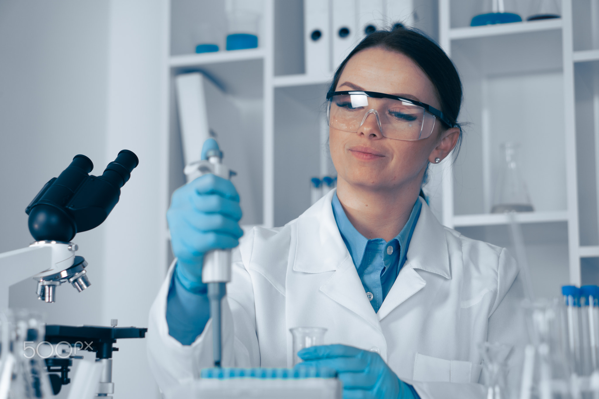 A dedicated scientist is conducting groundbreaking research in a stateoftheart lab, focusing on