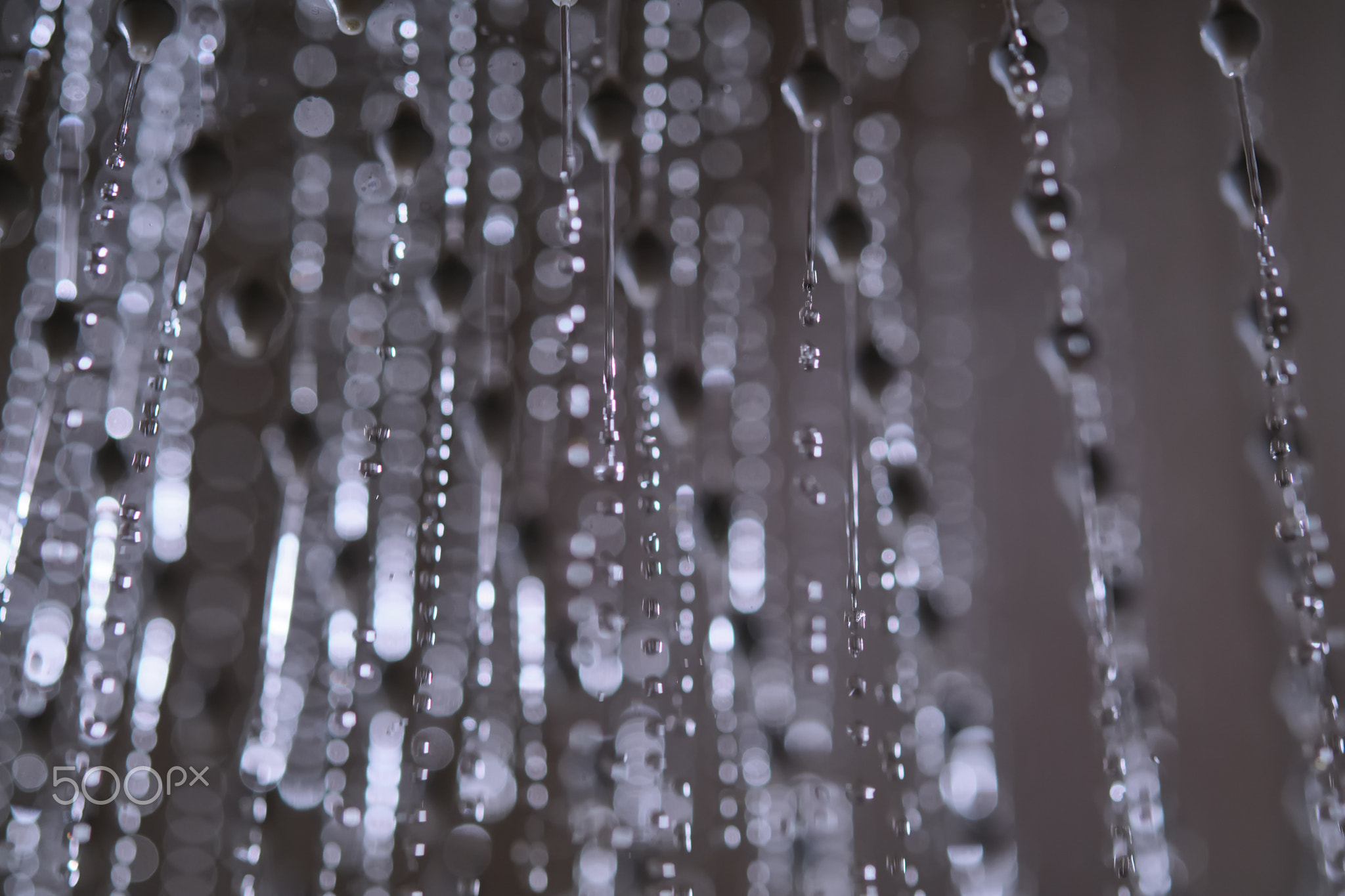 Abstract texture of water jets from the shower in close-up.