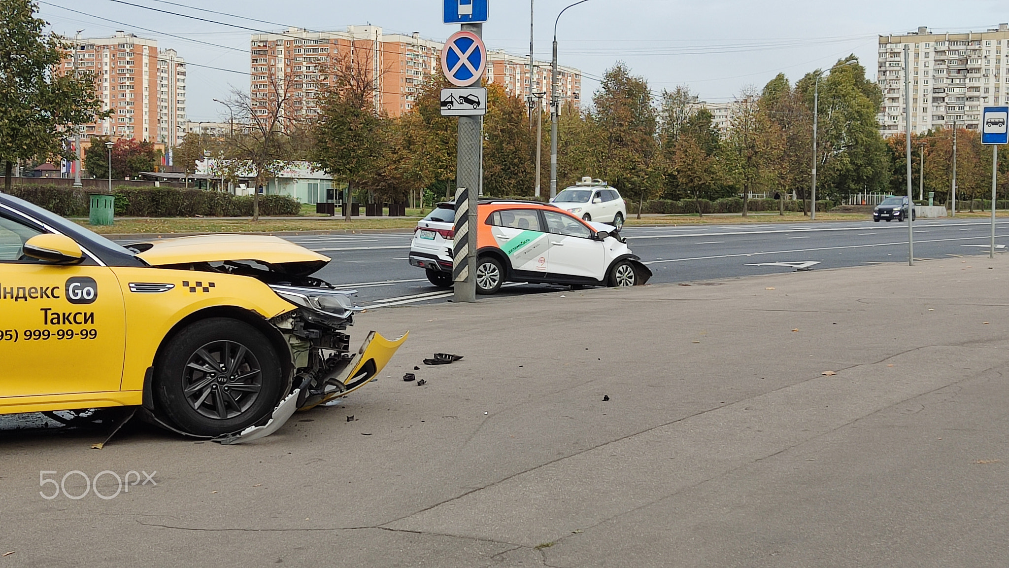 MOSCOW, RUSSIA - October 4, 2023: car accident involving a yellow taxi and a carsharing machine