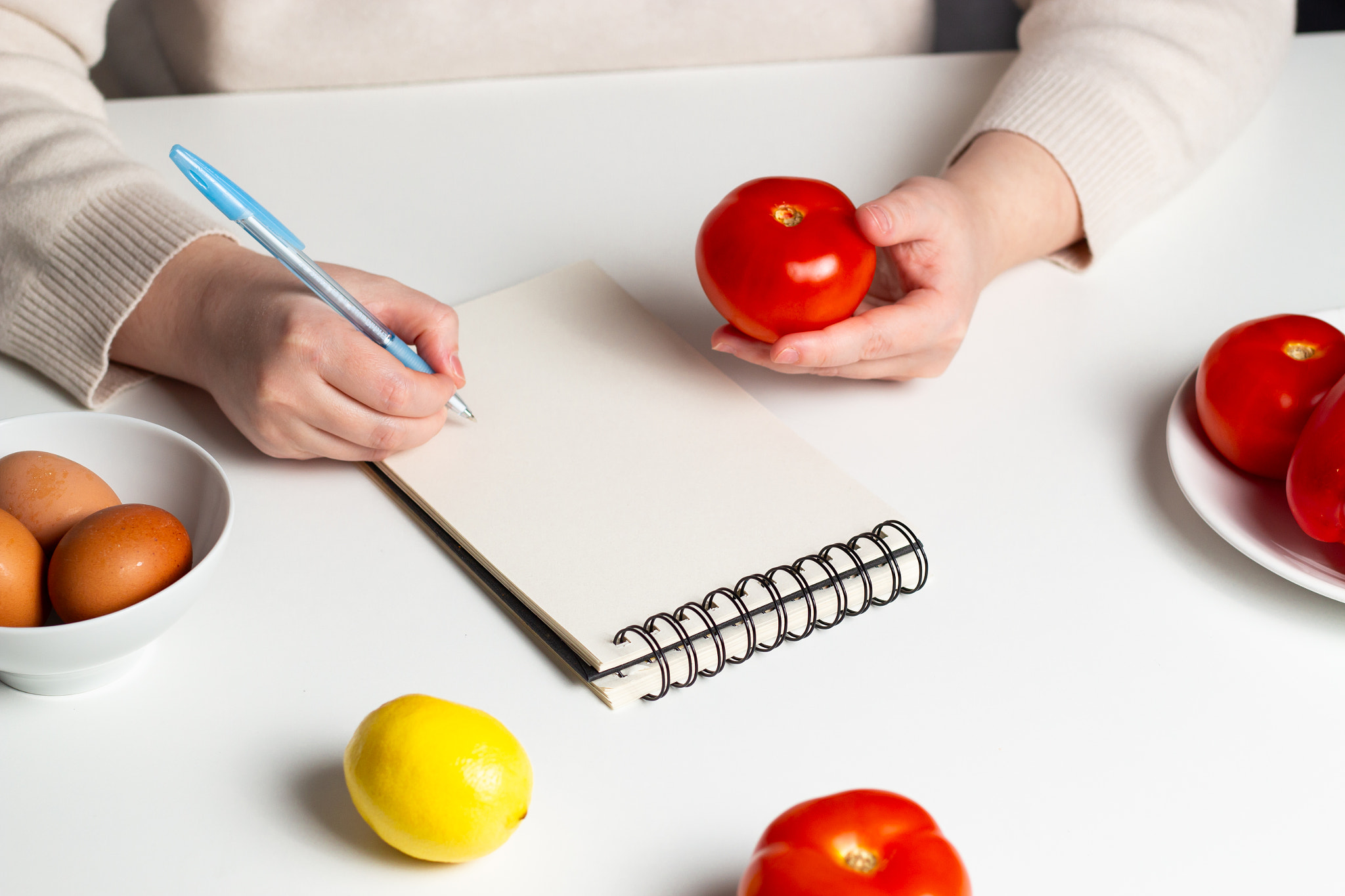 Nutritionist doctor writing down diet plan for patient. Healthy eating concept. Mock up. Flat lay. H