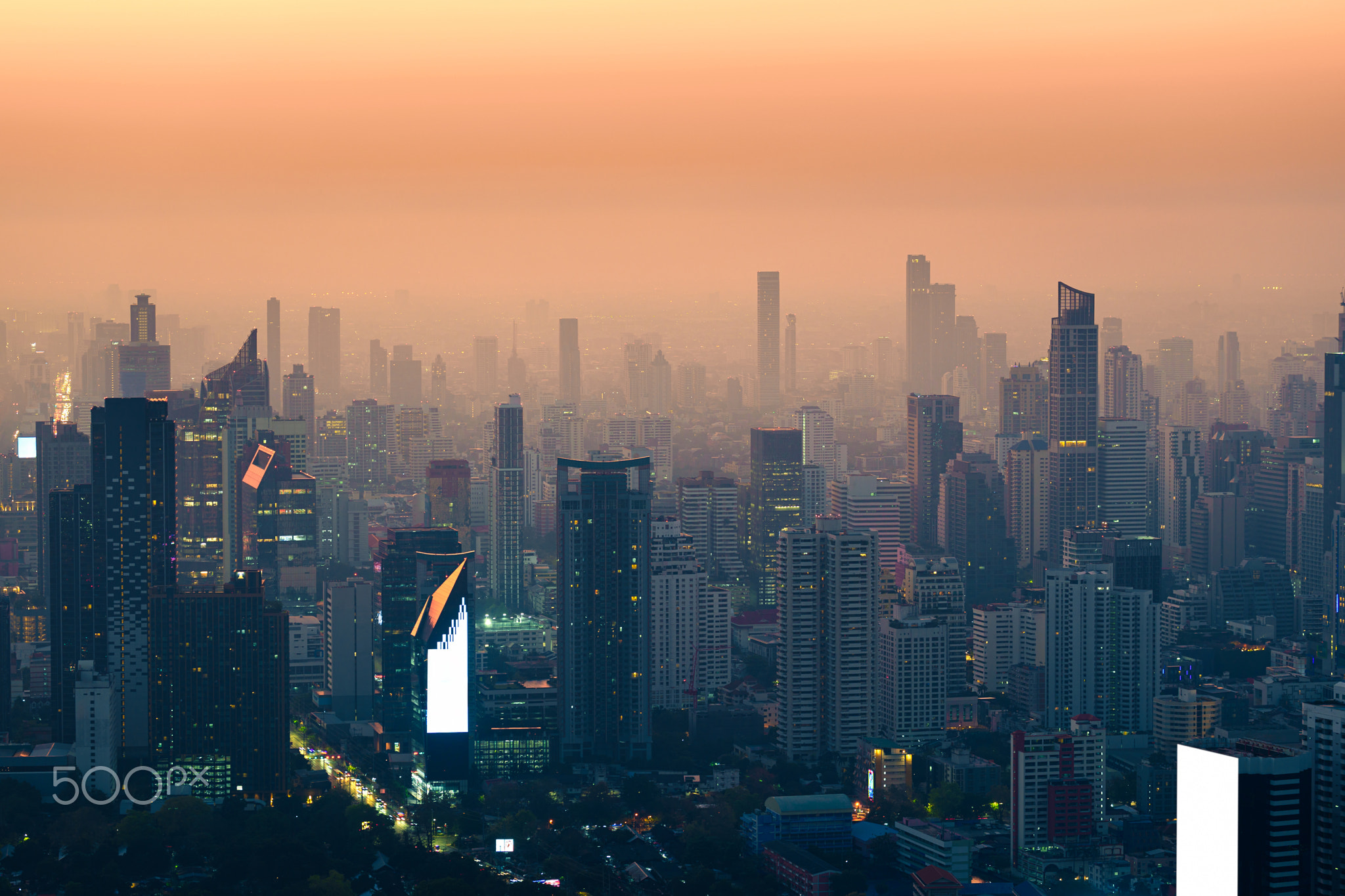 Crowded financial skyscraper in dust and smog