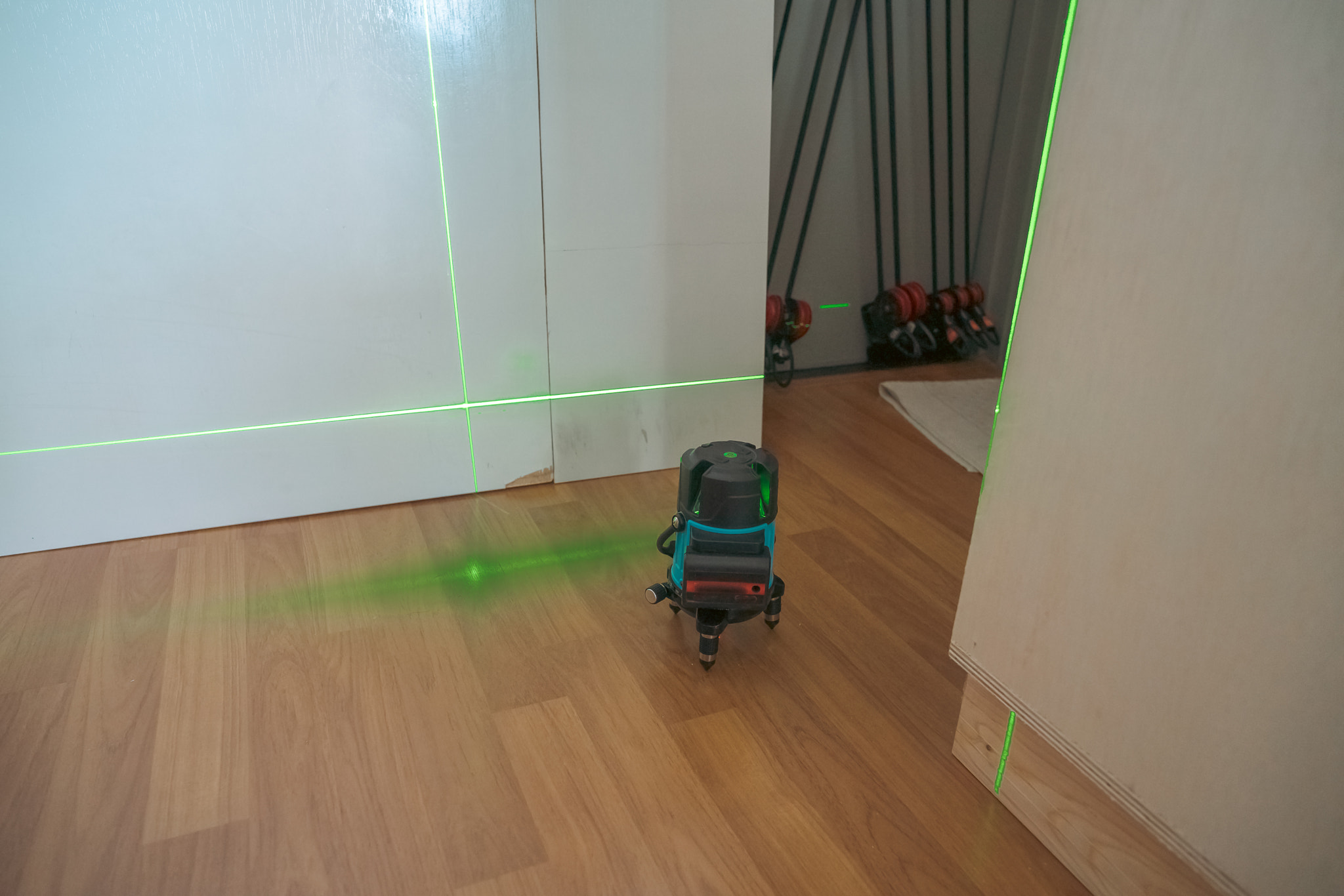 Construction laser level on the floor. Apartment renovation and construction work.