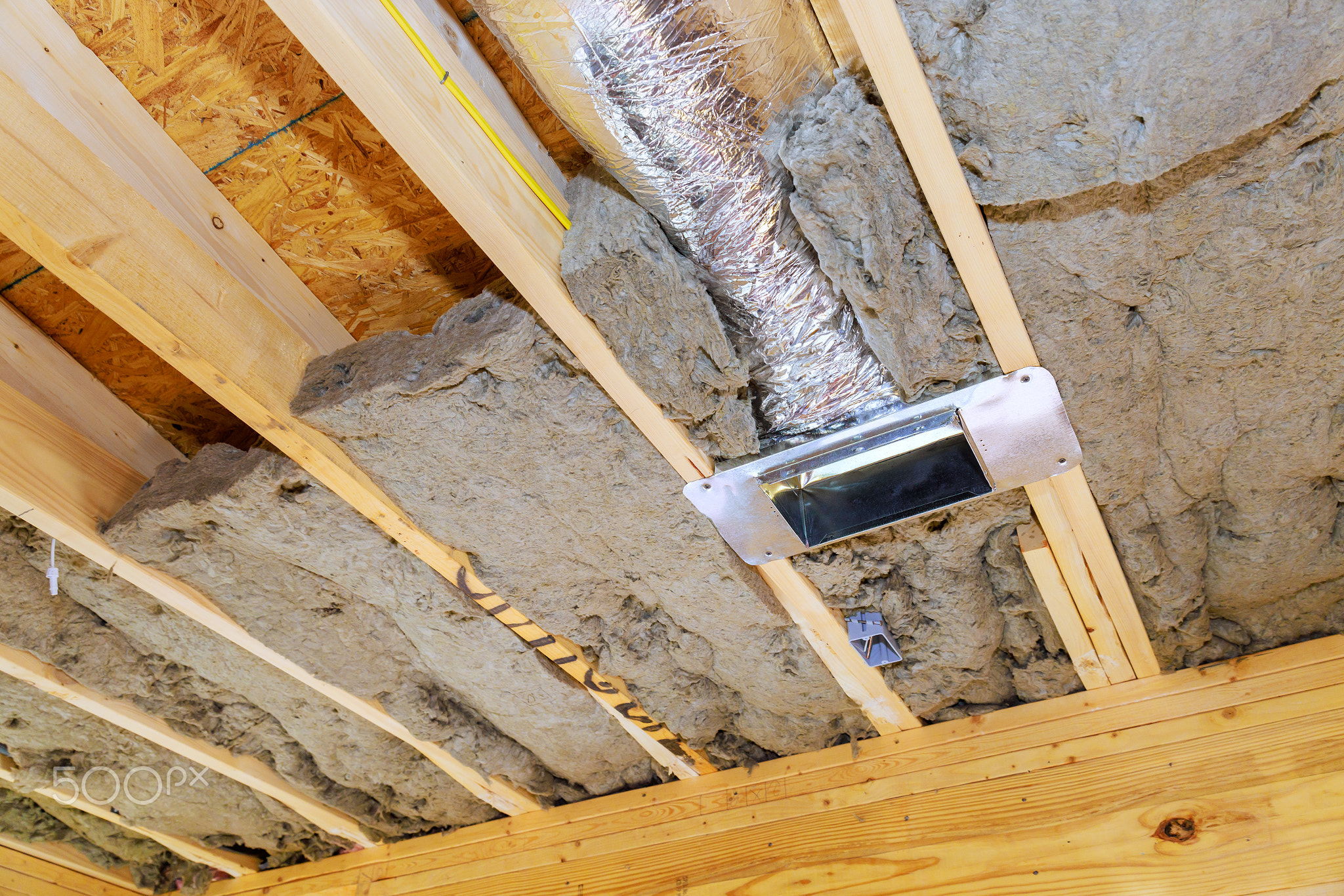 Insulation installation in a new building with a ventilation duct