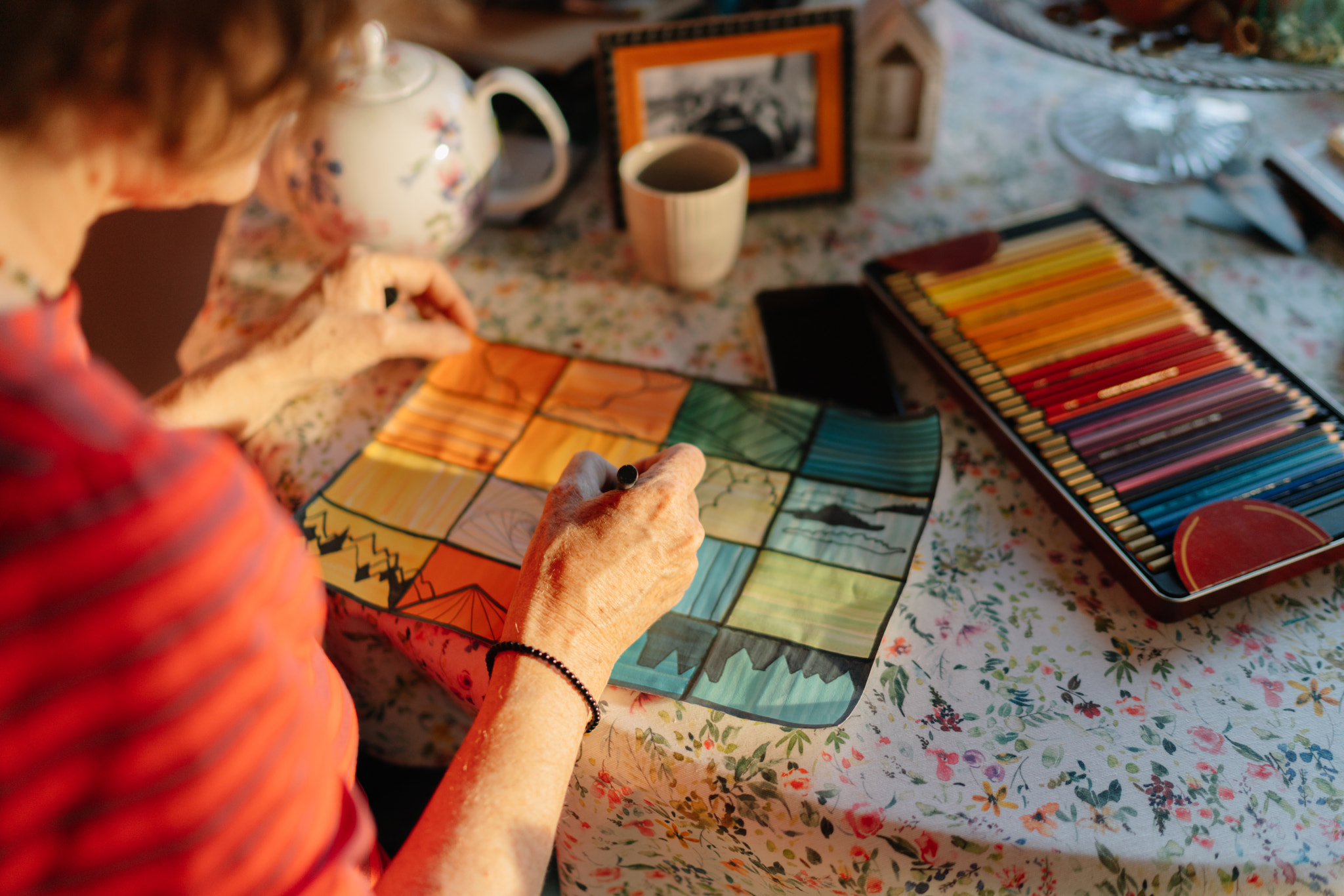 Senior woman making art product