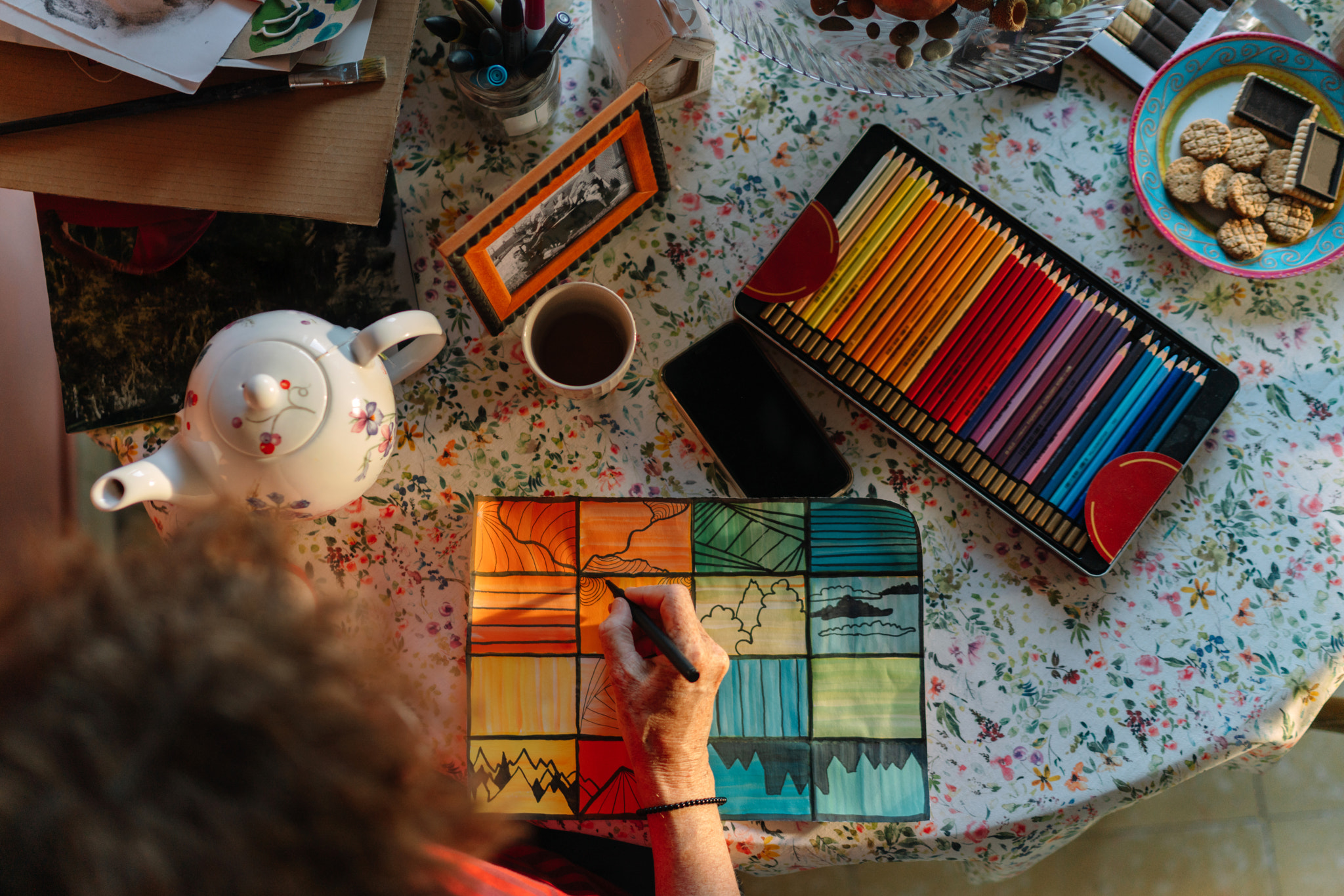 High angle view of woman painting on table