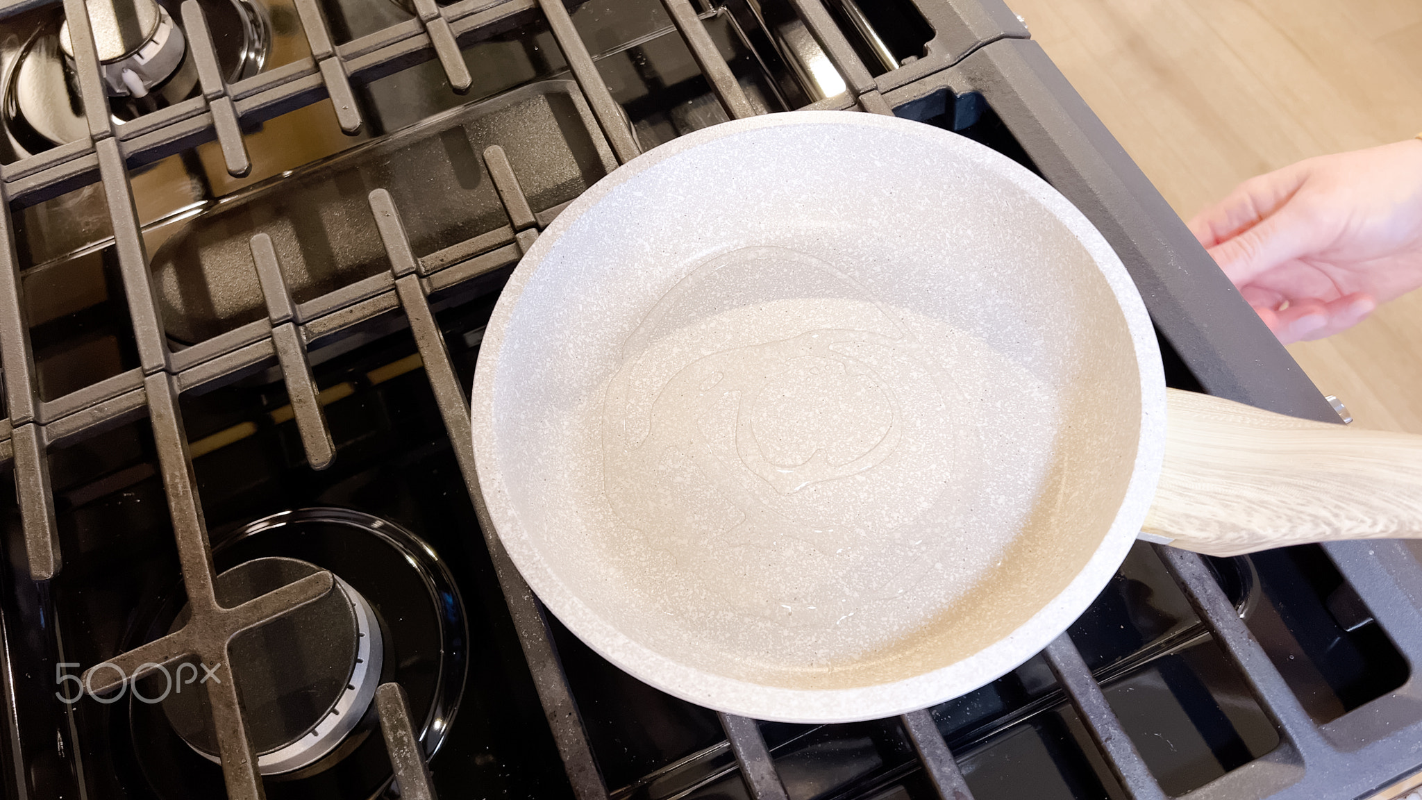 Cooking Breakfast with Sunny Side Up Eggs in a Non-stick Pan