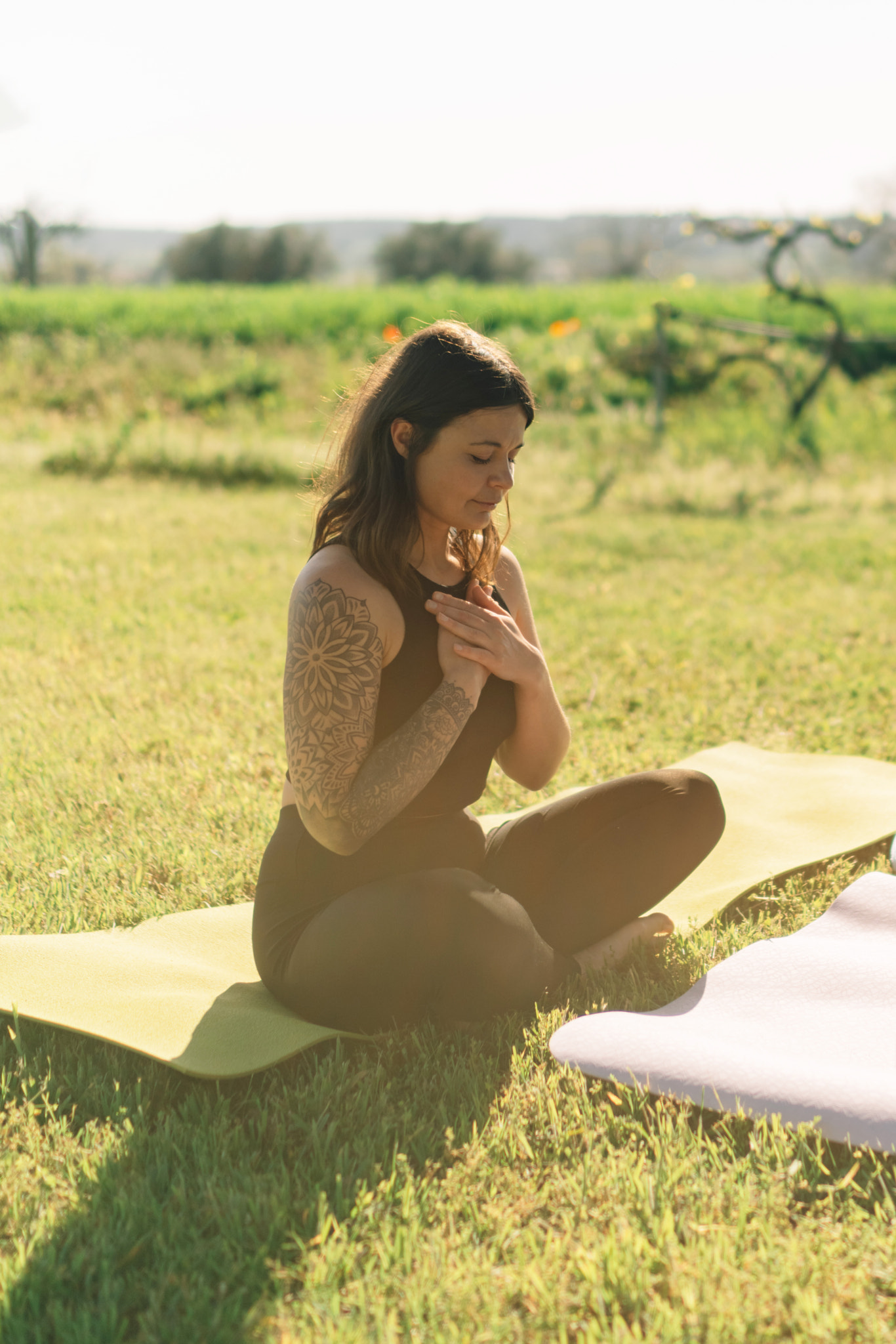 Young woman sitting on field