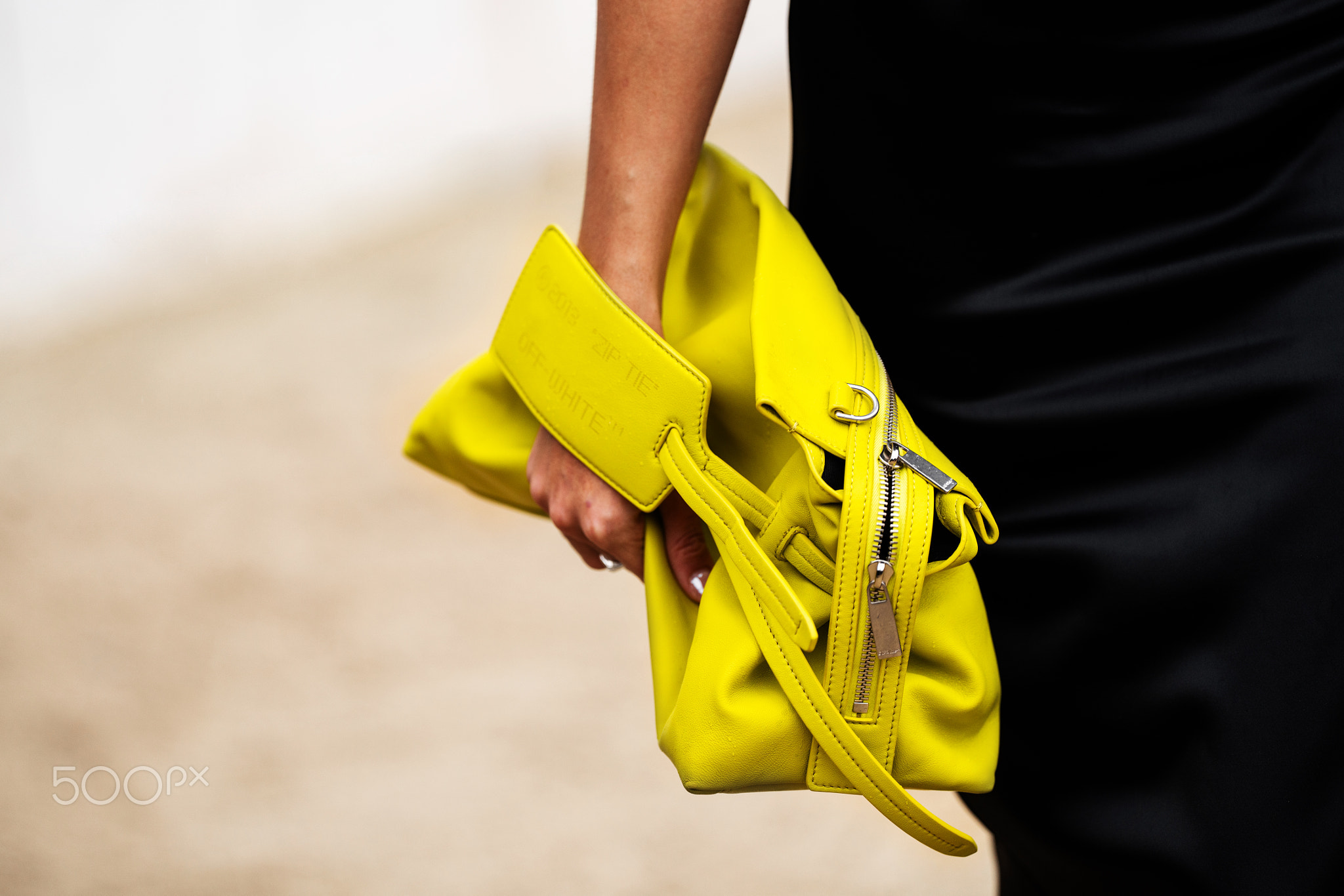 Paris, France - February, 28, 2024: woman wears Off-White bag, fashion