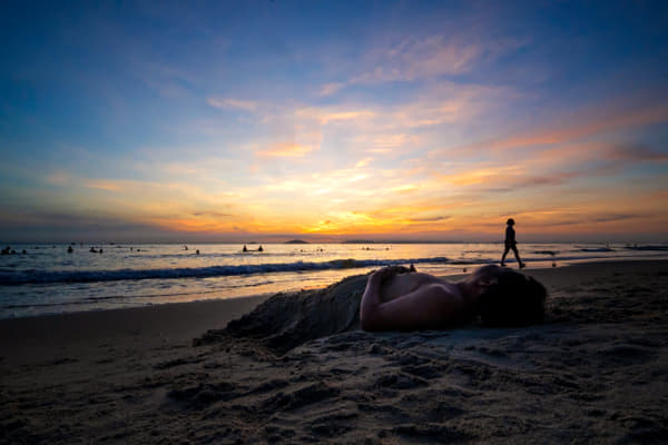 Silhouette woman standing at beach against sky during sunset by Ke Nguyen on 500px.com